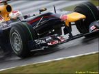 Себастьян Феттель за рулем Red Bull RB6 на трассе в Сузуке